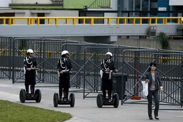 Peruvian policewomen ride segways to patrol the venues of the 2015 IMF/World Bank annual meetings event in Lima, October 6, 2015. Finance ministers and central bankers from around the world are gathering in Lima this week for meetings of the International Monetary Fund and the World Bank. The formal meetings begin on Friday and continue through Sunday. (Photo by Mariana Bazo/Reuters)