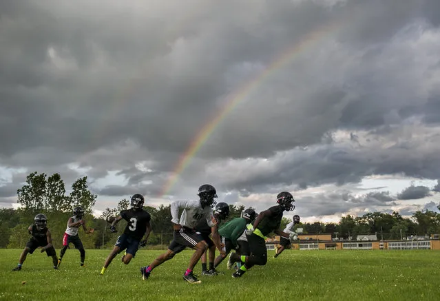 Ypsilanti Community High School football players practice for the first game of the season against Pioneer High School, Tuesday, August 11, 2015, in Ypsilanti, Mich. (Photo by Dominic Valente/The Ann Arbor News via AP Photo)