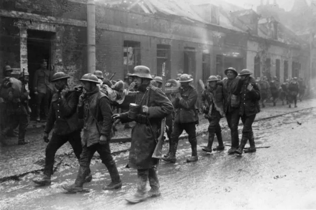 Wounded British and German troops in the streets of St Quentin, France, after the Second Battle of the Somme, 22nd March 1918. (Photo by Henry Guttmann/Getty Images)