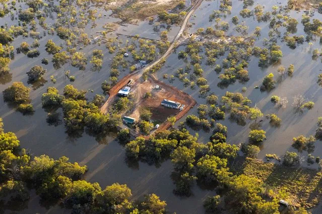 An aerial view of a property surrounded by flood water on December 09, 2022 in Louth, Australia. Rainfall over recent weeks and months has caused prolonged flooding in the Barwon-Darling River System and its tributaries, a release from the Bureau of Metrology said, and the consequences of unseasonally high rainfall are still being felt right through Western NSW even though rains have eased recently. Flooding in vast swathes of the Western Plains has turned properties into islands, still cut off from road access. River levels higher than the 1998 flood level occurred at many flood-hit communities across the state in the recent spell of wet weather, including at Louth and Tilpa, west of Bourke. (Photo by Jenny Evans/Getty Images)