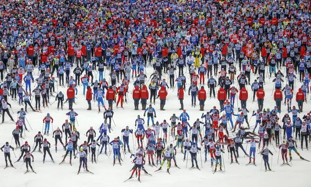 General view of the start of  the traditional cross country skiing mass race “Ski-Track of Russia” in Khimki, outside Moscow, Russia, 11 February 2023. Thousands of people took part in the competition all around Russia. (Photo by Sergei Ilnitsky/EPA)