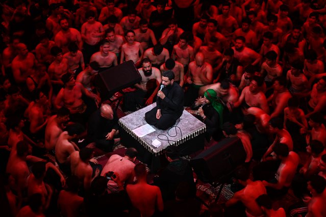 Shiite Muslims gather for a mourning ritual inside the Republic Mosque in Basra, Iraq on July 2, 2025, to mark the martyrdom of Imam Hussein, the grandson of Prophet Muhammad, and his 72 companions in the Battle of Karbala. As part of the Muharram commemorations, participants recite elegies and beat their chests in a traditional expression of grief. (Photo by Haidar Mohammed Ali/Anadolu via Getty Images)