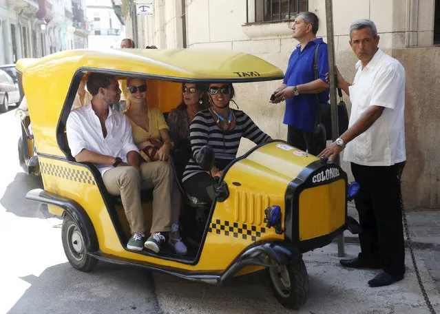Pierre Casiraghi (L), his wife Beatrice Borromeo Casiraghi (C) and his mother Princess Caroline of Hanover sit in a coco taxi in Havana, October 29, 2015. Princess Caroline of Hanover is in Cuba to attend the performance of the Les Ballets de Monte-Carlo during the XVI Havana Theater Festival, according to local media. (Photo by Reuters/Stringer)