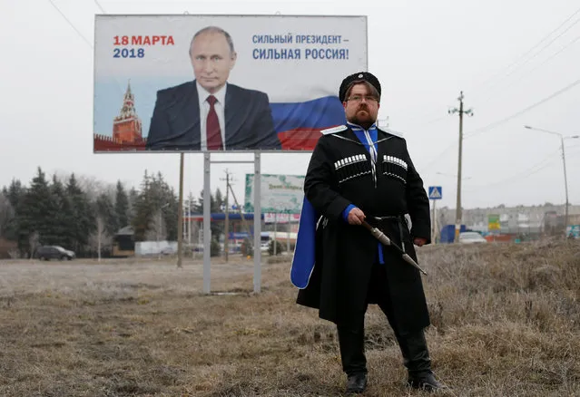 Andrei Vorontsov, 42, ataman of a local Cossack society and supporter of presidential candidate Vladimir Putin, poses for a picture in Mikhaylovsk town in Stavropol Region, Russia, February 21, 2018. “It's hard to say what the future will look like”, said Vorontsov. “The way I see it, people can make assumptions, but it's God that decides. The way He rules it, that's how things will be”. (Photo by Eduard Korniyenko/Reuters)