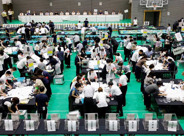 Election officials count votes at a ballot counting centre for Japan's upper house election in Tokyo, Japan, on July 20, 2025. (Photo by Manami Yamada/Reuters)