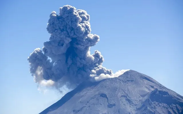 A view of a column of smoke composed of gasses exhausted from Popocatepetl Volcano, the second highest peak in Mexico with 5436 meters, linked with a saddle called “Paso de Cortes” to the twin volcano of Iztaccihuatl located near the border of State of Mexico at Izta-Popo Zoquiapan National Park in Puebla, Mexico on January 24, 2023. (Photo by Pablo Esparza/Anadolu Agency via Getty Images)