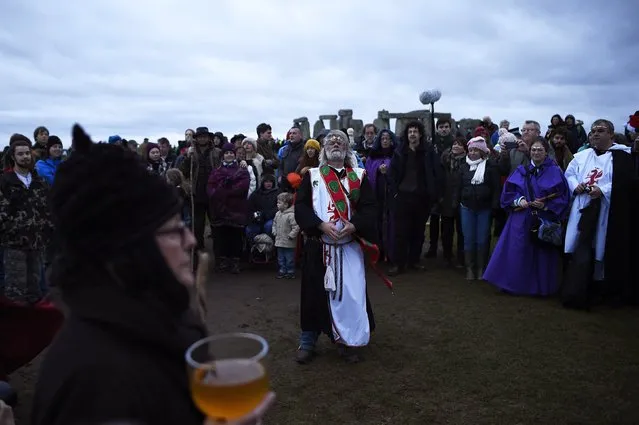 Druid Arthur Pendragon celebrates as the sun rises during the winter solstice at Stonehenge on Salisbury plain in southern England December 22, 2014. (Photo by Dylan Martinez/Reuters)