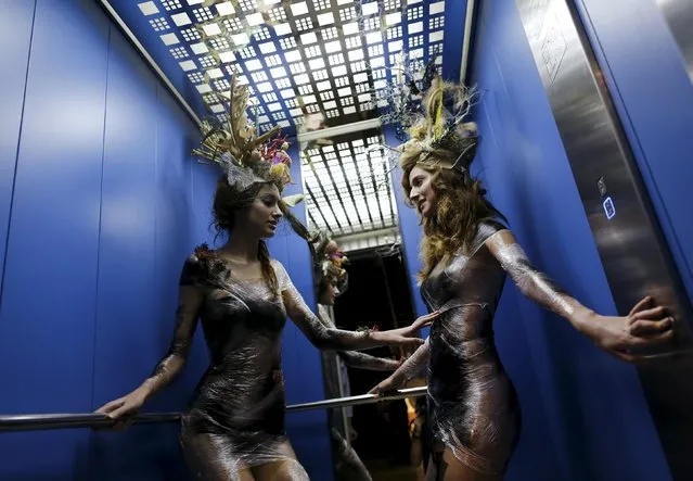 Models wearing creations by Luis Benitez are seen in an elevator during an urban shoot as part of Andalucia de Moda (Andalusia Fashion) at the aquarium of Seville, southern Spain, November 11, 2015. (Photo by Marcelo del Pozo/Reuters)