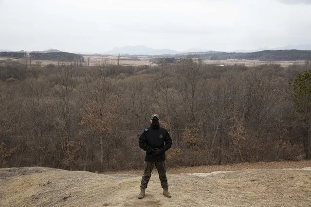 A South Korean soldier stands guard during a media tour of the Joint Security Area (JSA) in the Demilitarized Zone (DMZ) in the border village of Panmunjom in Paju on March 3, 2023. (Photo by Jeon Heon-Kyun/Pool via AFP Photo)