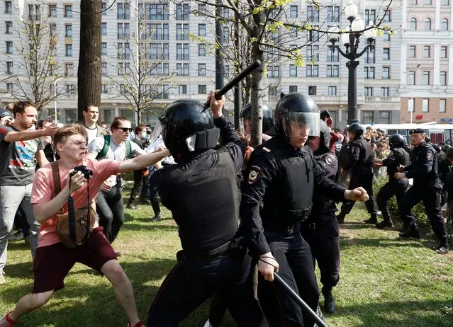 Russian riot police arrest participants of an unauthorized liberal opposition rally, called by their leader Alexei Navalny, prior to the official inauguration of president Putin, in Moscow, 05 May 2018. Russian opposition activists are continuing their protests against the re-election of president Vladimir Putin in March 2018. (Photo by Sergei Ilnitsky/EPA/EFE/Rex Features/Shutterstock)