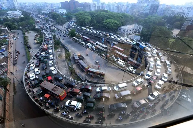 Vehicles stuck in the traffic jam in Dhaka, Bangladesh, on March 27, 2023. Last 10 years in Dhaka, average traffic speed has dropped from 21 km/hour to 7 km/hour, only slightly above the average walking speed. Congestion in Dhaka eats up 3.2 million working hours per day according to static reports. (Photo by Habibur Rahman/ABACA/Rex Features/Shutterstock)
