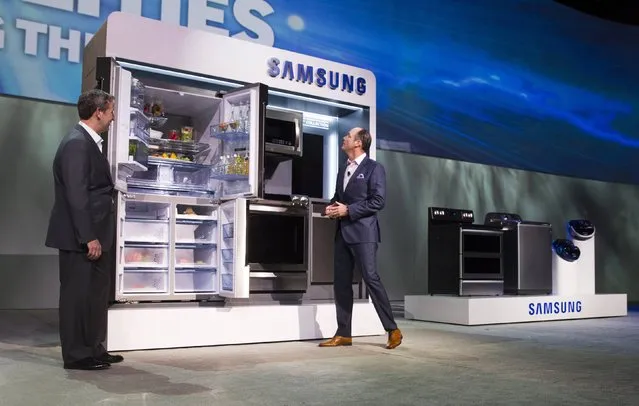 John Herrington (L), senior vice president of Samsung Electronics America, and Tim Baxter, president of Samsung Electronics America, pose by Samsung Chef Collection kitchen appliances at a Samsung Electronics news conference during the 2015 International Consumer Electronics Show (CES) in Las Vegas, Nevada January 5, 2015. (Photo by Steve Marcus/Reuters)