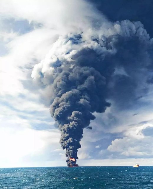 This handout picture from the Transport Ministry of China released on January 14, 2018 shows smoke and flames coming from the burning oil tanker “Sanchi” at sea off the coast of eastern China. An Iranian official said on January 14, 2018 there was no chance any crew members had survived among the 32 aboard an oil tanker on fire off the coast of China for more than a week. (Photo by AFP Photo/Transport Ministry of China)