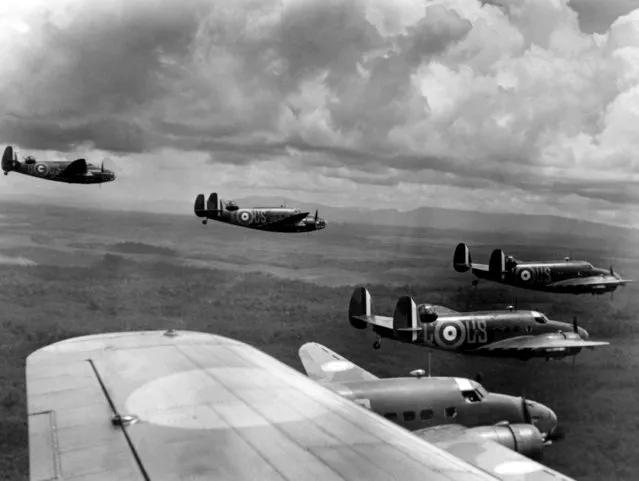 American-made bombers of the Royal Australian Air Force fly over Singapore Islands on May 4, 1941 in close formation during maneuvers. (Photo by Mc Daniel/AP Photo)