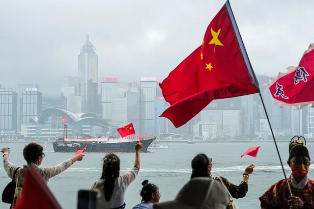 People wave Chinese flags during the 26th handover anniversary on July 1, 2023 in Hong Kong, China. Hong Kong is marking the 26th anniversary of its handover from Britain to China on July 1. (Photo by Sawayasu Tsuji/Getty Images)