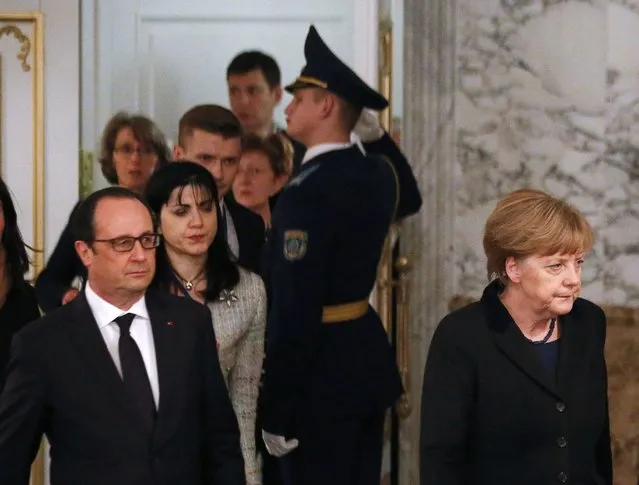 Germany's Chancellor Angela Merkel (R) and France's President Francois Hollande (L, front) walk as they attend a peace summit to resolve the Ukrainian crisis in Minsk, February 12, 2015. (Photo by Vasily Fedosenko/Reuters)