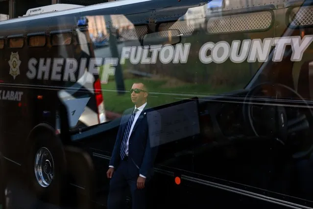 Secret Service agent stands outside the Fulton County jail as former President Donald Trump arrives to surrender on August 24, 2023 in Atlanta, Georgia. Trump was booked on multiple charges related to an alleged plan to overturn the results of the 2020 presidential election in Georgia. (Photo by Joe Raedle/Getty Images)