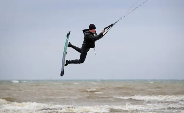 A kitesurfer enjoys the strengthening winds in Camber, East Sussex on Thursday, May 20, 2021. (Photo by Gareth Fuller/PA Images via Getty Images)