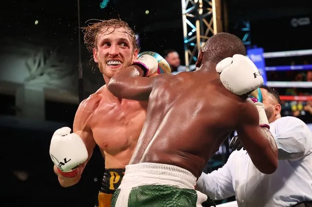 Floyd Mayweather exchanges blows with Logan Paul during their contracted exhibition boxing match at Hard Rock Stadium on June 06, 2021 in Miami Gardens, Florida. (Photo by Cliff Hawkins/Getty Images)