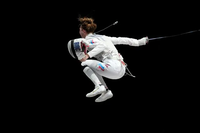 Russia's Larisa Korobeynikova celebrates after winning against Italy's Alice Volpi in the women's foil individual bronze medal bout during the Tokyo 2020 Olympic Games at the Makuhari Messe Hall in Chiba City, Chiba Prefecture, Japan, on July 25, 2021. (Photo by Fabrice Coffrini/AFP Photo)