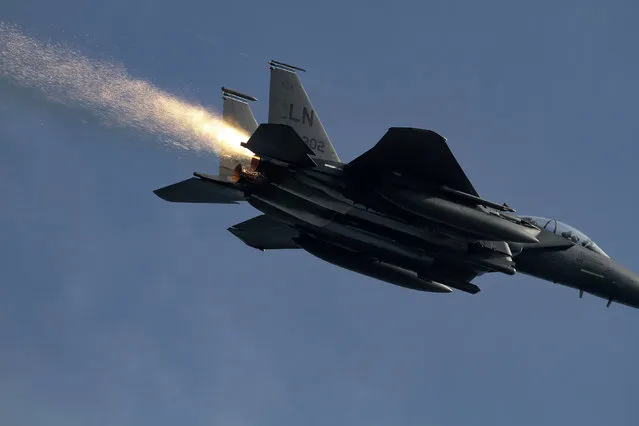 This photo made available by Ian Simpson on Friday July 23, 2021, shows a shower of sparks from an F-15E Strike Eagle that experienced a malfunction after takeoff, near RAF Lakenheath, Lakenheath, England, on July 13, 2021. Photographer Ian Simpson was honored by the 48th Fighter Wing for alerting Lakenheath about the troubles when he realized the pilot wasn’t aware of the issue. (Photo by Ian Simpson via AP Photo)
