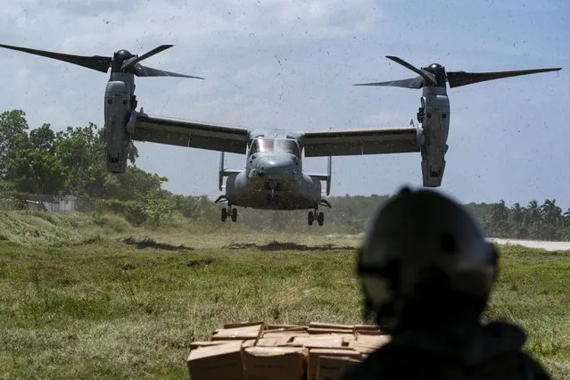 A VM-22 Osprey, with a load of aid lands, at Jeremie Airport, Saturday, August 28, 2021, in Jeremie, Haiti. The VMM-266, “Fighting Griffins”, from Marine Corps Air Station New River, from Jacksonville, N.C., are flying in support of Joint Task Force Haiti after a 7.2 magnitude earthquake on Aug. 22, caused heavy damage to the country. (Photo by Alex Brandon/AP Photo)