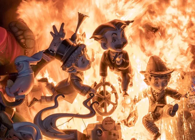 A falla burns during the traditional Fallas festival in Valencia, Sunday September 5, 2021. Valencia‚Äôs Fallas festival kicked off on Sept. 1 after a two-year break as a result of the coronavirus pandemic. Fallas are gigantic structures made of cardboard portraying current events and personalities which are burned during the finale of the festival. (Photo by Alberto Saiz/AP Photo)