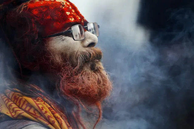 A Hindu holy man arrives at the Pashupatinath Temple in Katmandu, Nepal, Wednesday, February 26, 2014. Shivratri, a festival dedicated to the worship of Hindu God Shiva, will be celebrated Thursday. (Photo by Niranjan Shrestha/AP Photo)