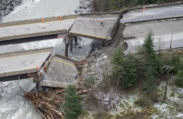 In this aerial photo, damage caused by heavy rains and mudslides earlier in the week is pictured along the Coquihalla Highway near Hope, British Columbia, Thursday, November 18, 2021. (Photo by Jonathan Hayward/The Canadian Press via AP Photo)