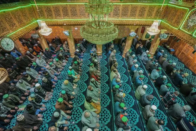 Muslims offer prayer inside a Mosque on the first day of Ramadan, in Srinagar, Indian controlled Kashmir, Tuesday, March 12, 2024. The Muslim holy month of Ramadan, when the faithful fast from dawn to dusk, began at sunrise Tuesday in much of Asia. (Photo by Mukhtar Khan/AP Photo)