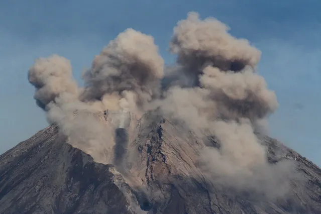 Mount Semeru volcano spews hot ash as seen from Pronojiwo district in Lumajang, East Java province, Indonesia, December 10, 2021, in this photo taken by Antara Foto. (Photo by Ari Bowo Sucipto/Antara Foto via Reuters)