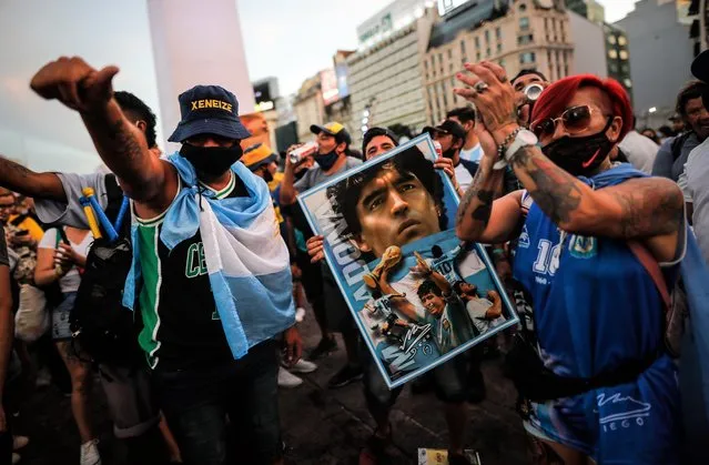 Followers of Diego Armando Maradona take part in a demonstration to demand justice for the death of the Argentine star, in downtown Buenos Aires, Argentina, 10 March 2021. Supporters and relatives of former Argentine footballer Diego Armando Maradona demonstrate in downtown Buenos Aires to demand justice for the death of the idol, which is the subject of an investigation to determine if there was any negligence around his medical care. (Photo by Juan Ignacio Roncoroni/EPA/EFE)
