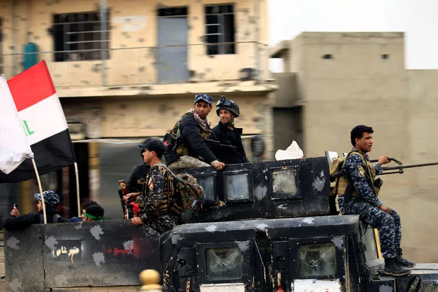 Members of the Counter Terrorism Service (CTS) sit in a military vehicle during a battle between Iraqi forces and Islamic State militants, in the city of Mosul, Iraq March 15, 2017. (Photo by Thaier Al-Sudani/Reuters)