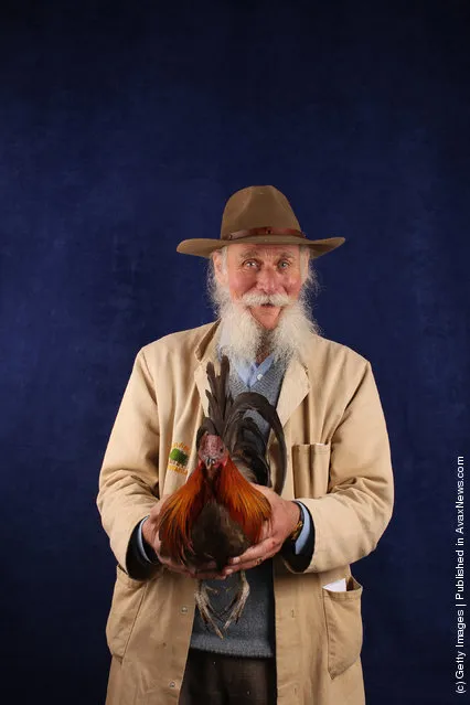 Dave Thorn, from Oxfordshire, holds his 12 month old Oxford Dun Cock