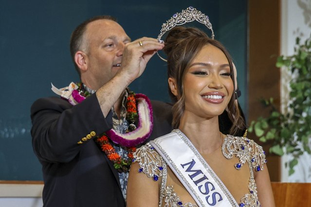 In this image provided by the Office of Governor Josh Green, Hawaii Gov. Josh Green crowns Savannah Gankiewicz Miss USA 2023 on Wednesday, May 15, 2024, in Honolulu. Gankiewicz was crowned on Wednesday, more than a week after the previous titleholder resigned citing her mental health. (Photo by Office of Governor Josh Green, M.D. via AP Photo)