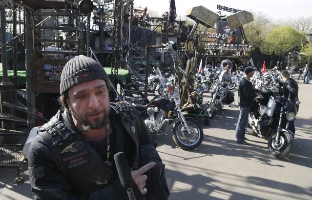 Alexander Zaldostanov (L), leader of the Russian motorcycle club the Night Wolves speaks with media as he and and his club-mates start their rally from Moscow to Berlin “Victory Roads – to Berlin” from Bike Center in the Lower Mnevniki street in Moscow, Russia, 29 April 2016. The annual “Victory Roads – to Berlin” motorcycle rally marking the 71st anniversary of victory over the nazi Germany in WWII lasts for 14 days and covers 6,000 km. (Photo by Maxim Shipenkov/EPA)