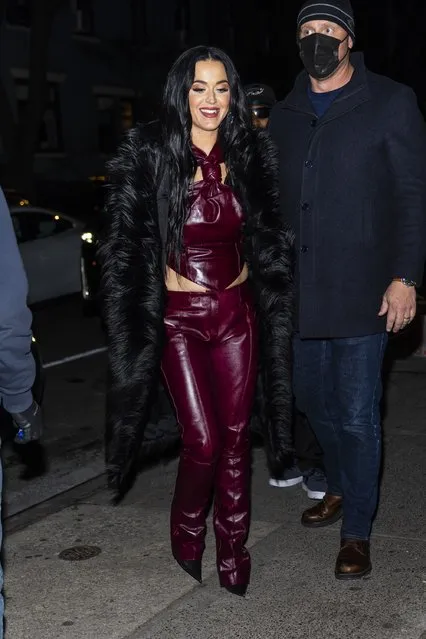 American singer-songwriter Katy Perry is pictured stepping out in New York City on January 27, 2022 after rehearsal for Saturday Night Live. The pop star and actress wore a black trench coat, burgundy leather top, matching trousers, and boots. (Photo by The Image Direct)
