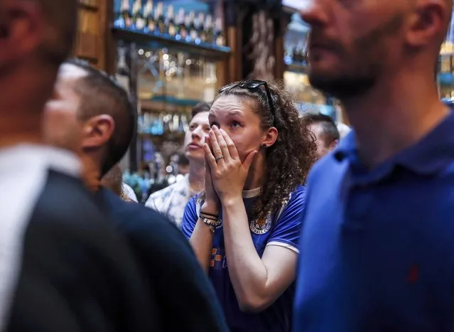 Leicester City fans react during their team's soccer match against Manchester United, as they watch the match on television in the Hogarth's pub in Leicester, Britain May 1, 2016. (Photo by Eddie Keogh/Reuters)