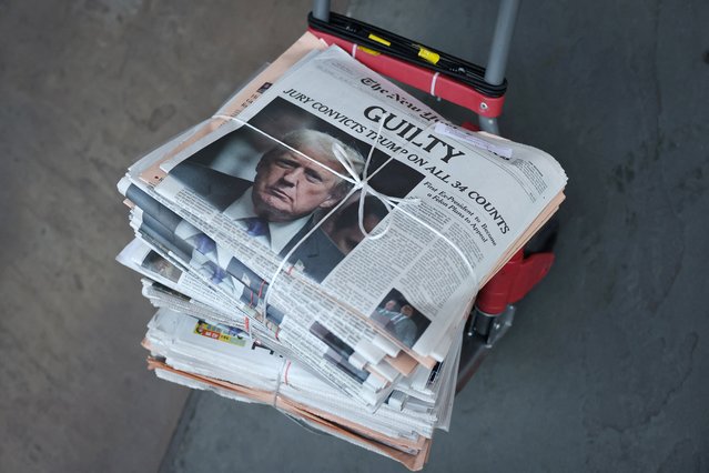 A copy of the New York Times featuring an image of former U.S. president Donald Trump is delivered the day after the verdict of his criminal trial over charges that he falsified business records to conceal money paid to silence p*rn star Stormy Daniels in 2016, in New York City, U.S., May 31, 2024. (Photo by Andrew Kelly/Reuters)
