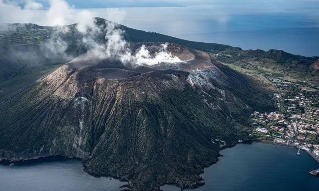 A helicopter aerial view of the island of Vulcano with CO2 gas emissions in the crater area on January 28, 2022 in Vulcano porto, Italy. In December 150 people were evacuated from the island of Vulcano, in Sicily's Aeolian archipelago. This is due to increased volcanic activity and the release of toxic gases in the area which is ongoing. (Photo by Fabrizio Villa/Getty Images)