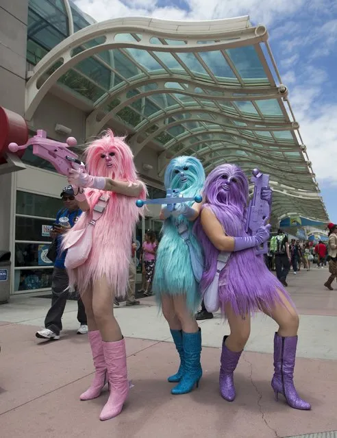 Star Wars enthusiasts wear costumes resembling what they say are three “Chew's Angels” during the 2015 Comic-Con International Convention in San Diego, California July 10, 2015. (Photo by Mario Anzuoni/Reuters)