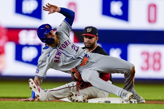 New York Mets' Ben Gamel, left, is safe at second base on the steal as he falls over onto Washington Nationals second baseman Ildemaro Vargas during the 10th inning of a baseball game at Nationals Park, Tuesday, July 2, 2024, in Washington. The Mets won 7-2 in 10 innings. (Photo by Alex Brandon/AP Photo)
