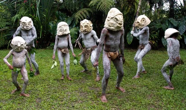 The mudmen, naked apart from a leaf covering their genitals, put on a fearsome display. (Photo by Jeremy Hunter/Exclusivepix Media)