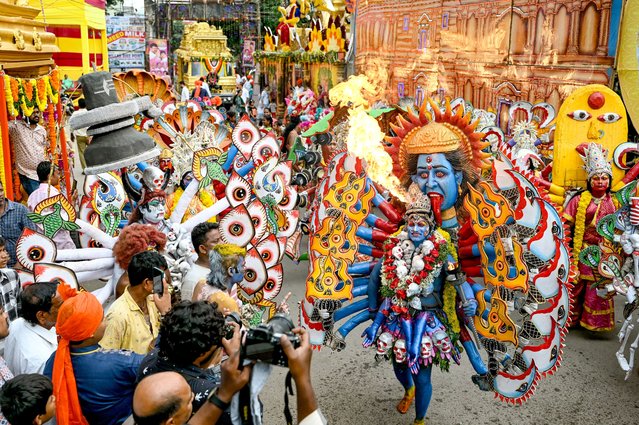 Artists dressed as Hindu deity Mahakali, perform during a procession to mark Bonalu festival at Akkanna Madanna temple in Hyderabad on July 29, 2024. (Photo by Noah Seelam/AFP Photo)