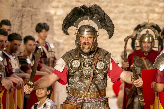 People wearing clothing from Roman Empire period perform within the “Rome Days” Festival at the Amphitheater of El Djem in Mahdia Governorate south of Tunis, Tunisia on April 30, 2023. (Photo by Yassine Gaidi/Anadolu Agency via Getty Images)