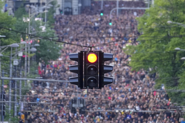 People march during a rally against violence in Belgrade, Serbia, Friday, May 12, 2023. Serbia’s populist leader has sharply denounced opposition plans to block a key bridge and highway in Belgrade on Friday to press their demands in the wake of last week’s mass shootings in the Balkan country that left 17 people dead, including many children. (Photo by Darko Vojinovic/AP Photo)