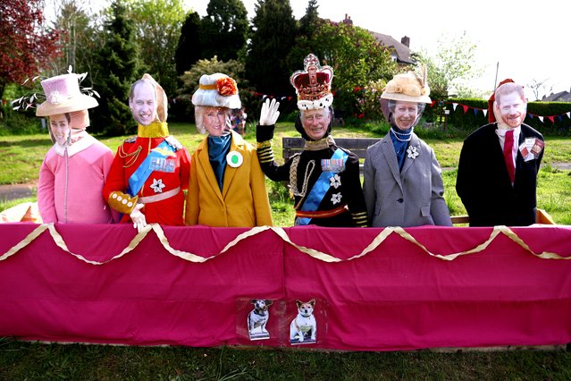 Britain's Royal Family scarecrows standing on a balcony are pictured in the village of Sheriffhales, Shifnal, Shropshire, Britain on May 4, 2023. (Photo by Carl Recine/Reuters)