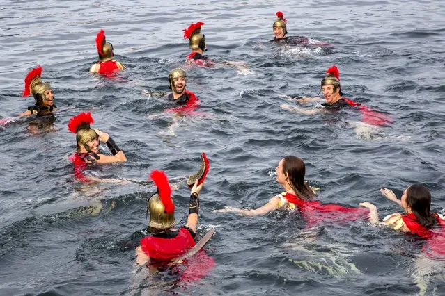 Participants of the 81th edition of the annual Christmas swimming “Coupe de Noël” swim in the lake of Geneva, in Geneva, Switzerland, Sunday, December 15, 2019. More than 2500 men and women swam the 120 meters at the traditional Christmas swimming in Geneva where the water temperature was 8 degrees. (Photo by Magali Girardin/Keystone)