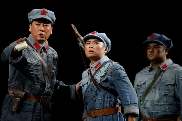 Wang Zenan (L), in the leading role and others perform on the stage of the National Centre for the Performing Arts during opera's final dress rehearsal in Beijing, China July 27, 2017. “Jinsha River”, the opera adapted from a novel of the same name telling the story of the Red Army on the long march in Tibetan area in 1935, will have its premiere as the country marks the 90th anniversary of the founding of Chinese People's Liberation Army (PLA). (Photo by Damir Sagolj/Reuters)