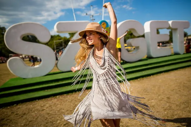 Festival goers participate at the 25th Sziget (Island) Festival on Shipyard Island, Northern Budapest, Hungary, 15 August 2017. (Photo by László Mudra/Rockstar Photographers)